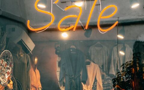 Eye-catching neon 'Sale' sign in a fashion boutique window in Istanbul, Turkey.