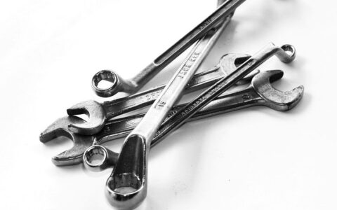 A collection of steel wrenches displayed against a white backdrop, perfect for toolkits.
